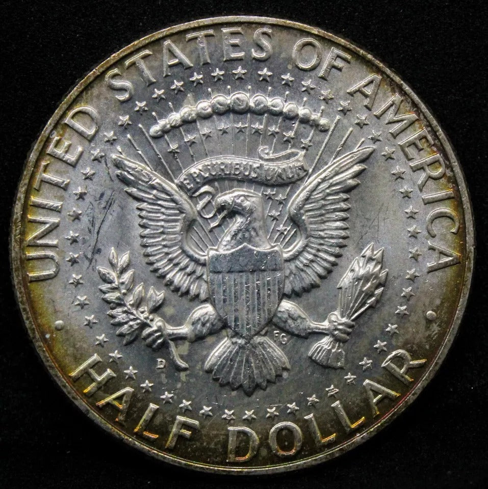 1/2 Dollar 1964-D, Kennedy . UNC with golden toning. (half $)