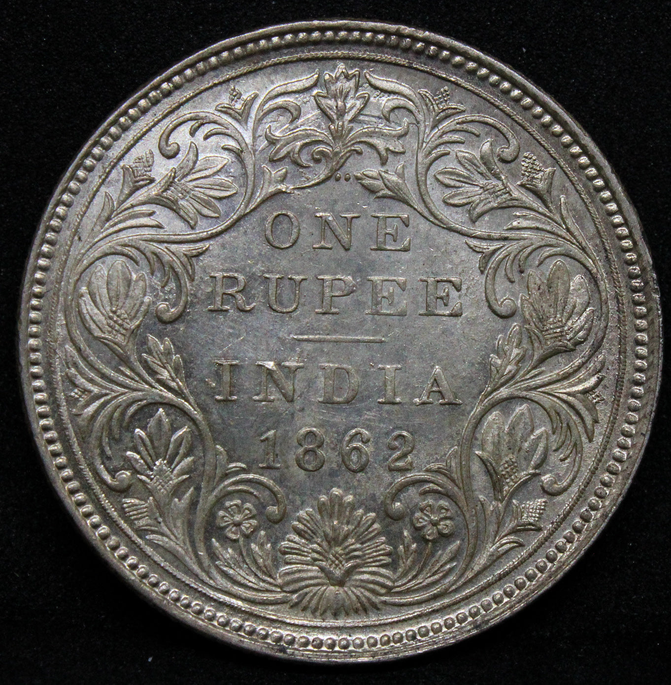 1862 India-British Rupee Victoria KM 473.1 ..... 2/0 beads. UNC