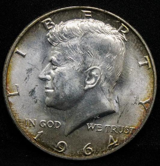 1/2 Dollar 1964-D, Kennedy . UNC with golden toning. (half $)